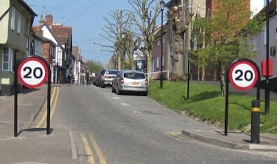 Prominent 20 mph signage, and traffic slowing pinch point, in Saffron Walden