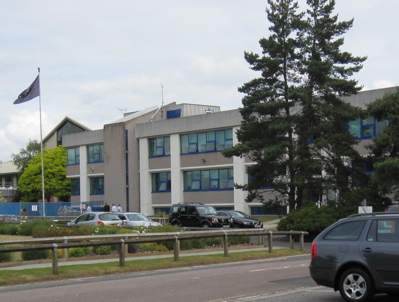 Cambridgeshire Police Headquarters, with the Chief Officers Shiny Cars Outside