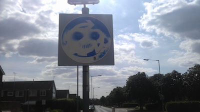 Graffitied Roundabout Sign