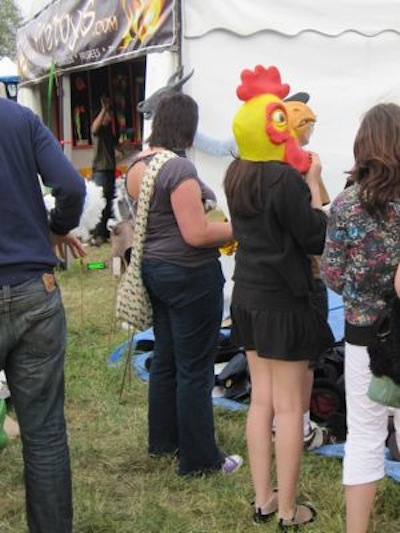 A girl with a chicken's head at the 2009 Strawberry Fair.