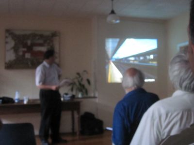 Rob Fairhead of Network Rail showing a Cambridge Cycling Campaign open meeting a computer generated image of Cambridge Station with its new island platform.  