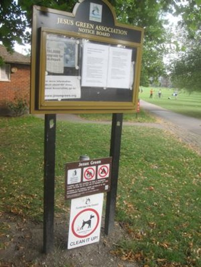 Sign obstructing access to JGA noticeboard keyhole moved.