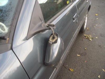 Images of broken wing mirrors and broken glass