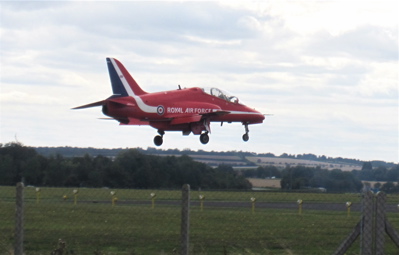 I stood on Newmarket Road and watched the Red Arrows fly in to Cambridge Airport. They first flew over in formation, emitting white smoke as they flew over the airfield.  They then split up, half on one side of the runway half on  the other, then came round to land one by one with only a few seconds between each plane.