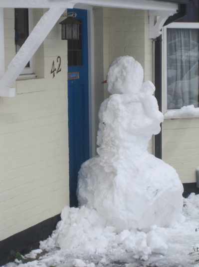 Snowman Built In-front of Door in Cambridge