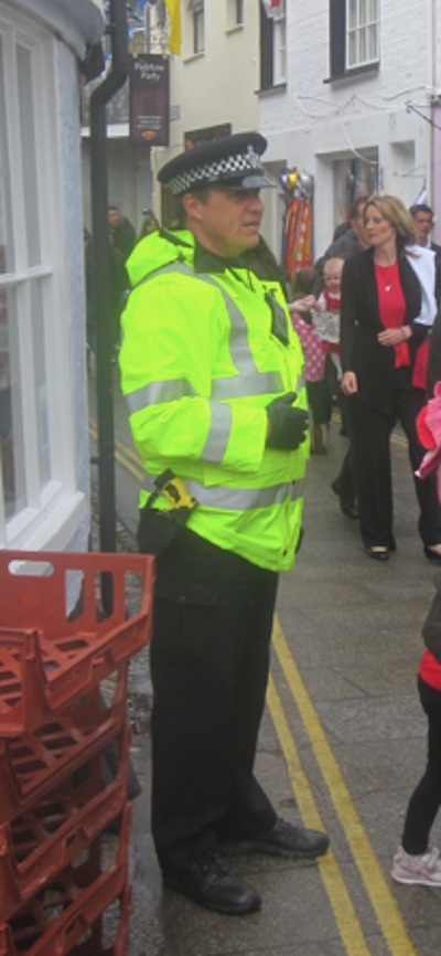 TASER armed officer on duty outside a pasty shop in Padstow, Cornwall.